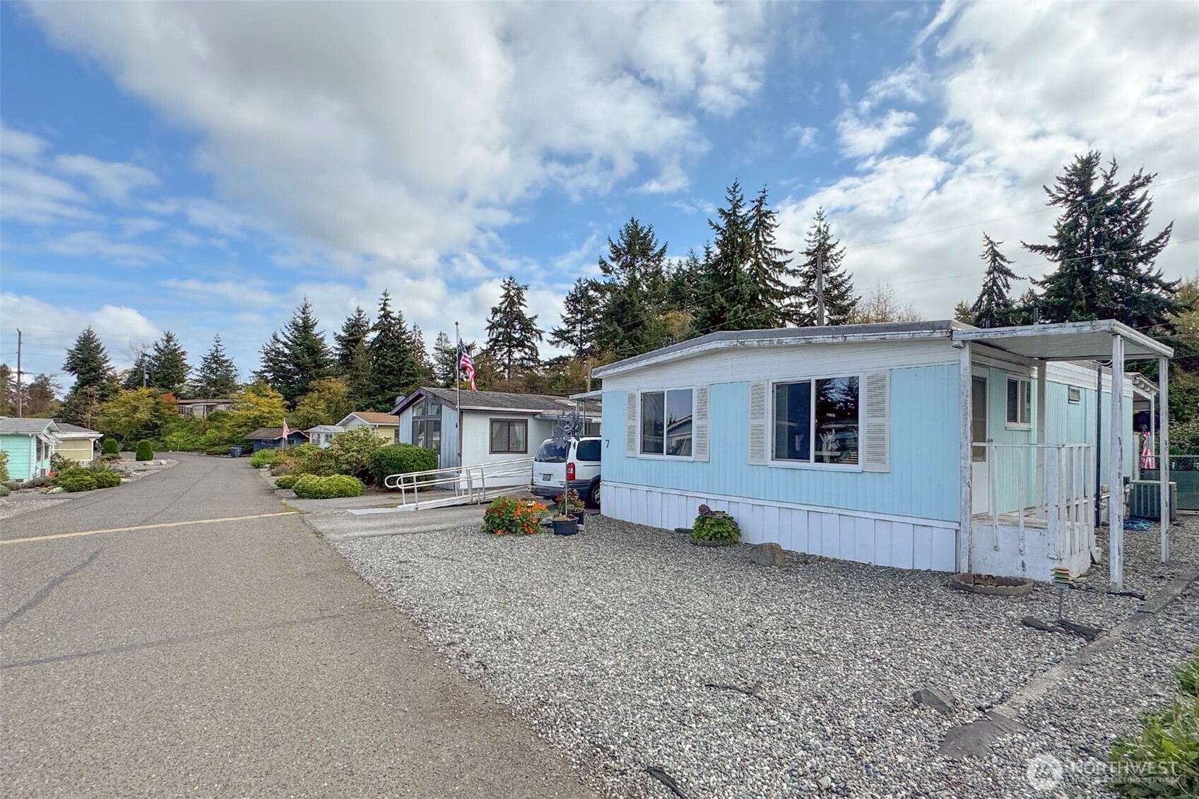 921 South 3rd Avenue, Unit 7 Sequim, WA 98382 - Photo 3 of 32 a view of a house with backyard and sitting area