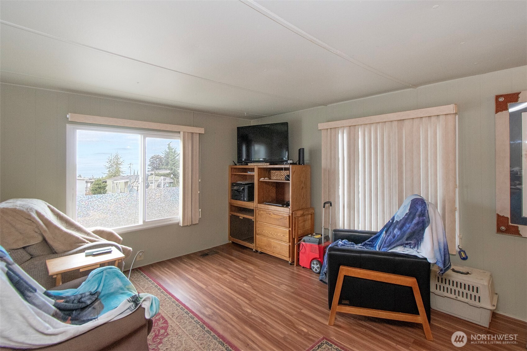921 South 3rd Avenue, Unit 7 Sequim, WA 98382 - Photo 5 of 32 a living room with furniture and a flat screen tv