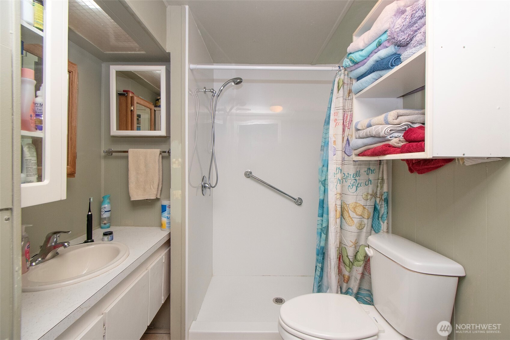 921 South 3rd Avenue, Unit 7 Sequim, WA 98382 - Photo 10 of 32 a bathroom with a sink toilet and shower