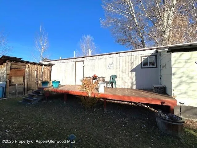 a view of backyard with swimming pool