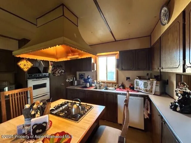 a kitchen with a table and chairs in it