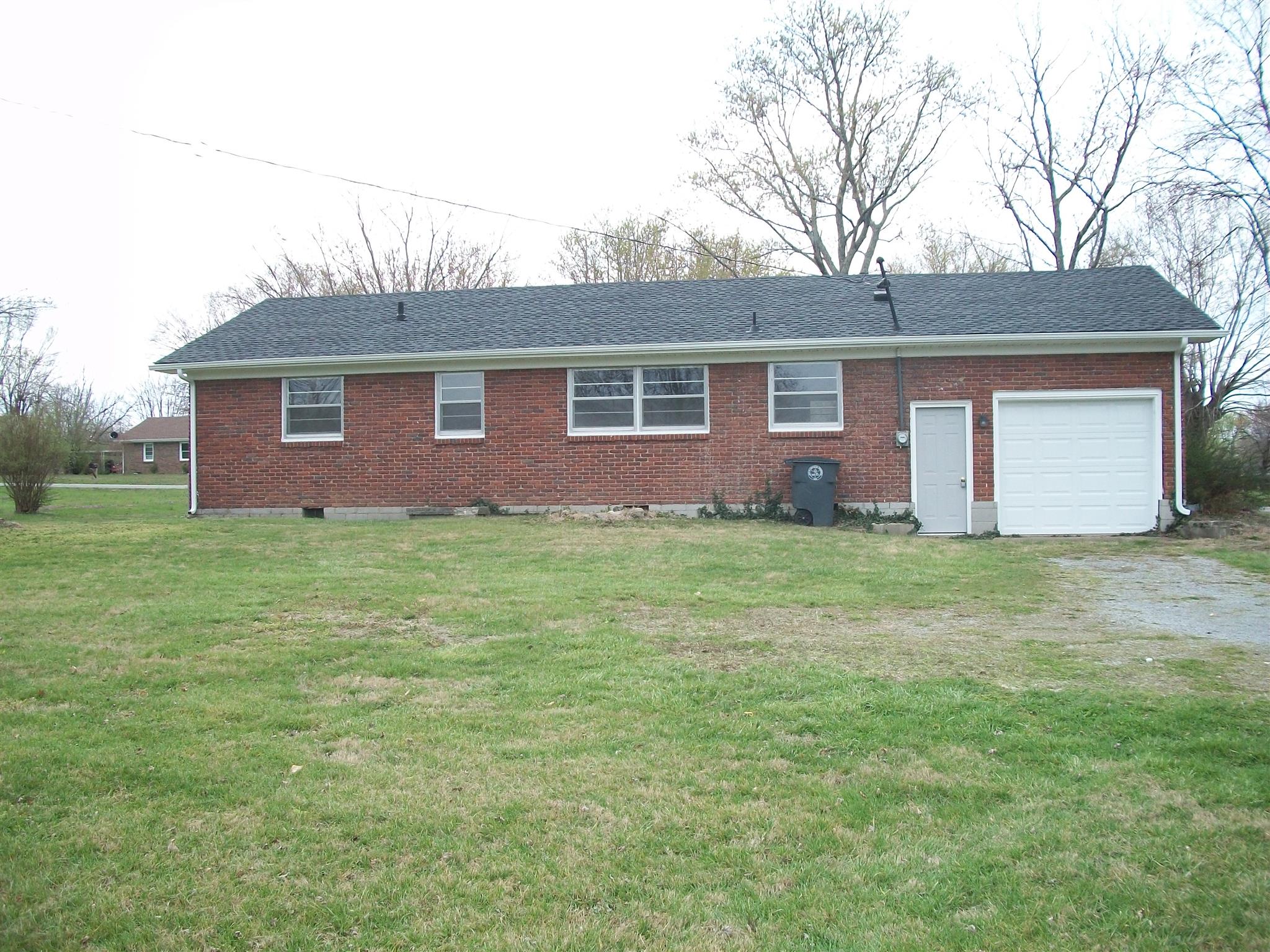 1014 King Road Lafayette, TN 37083 - Photo 6 of 17 the back of the home viewing new garage and walk in door