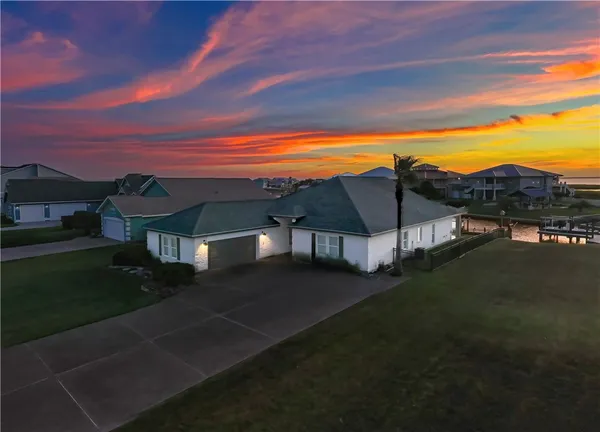 a view of a big yard next to a house with a yard