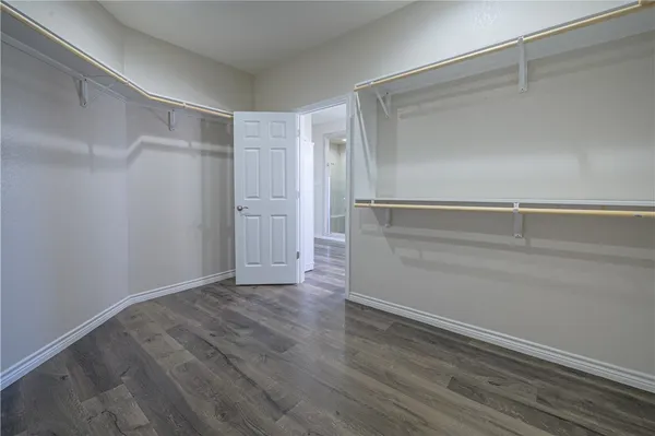 a view of an empty walk in closet