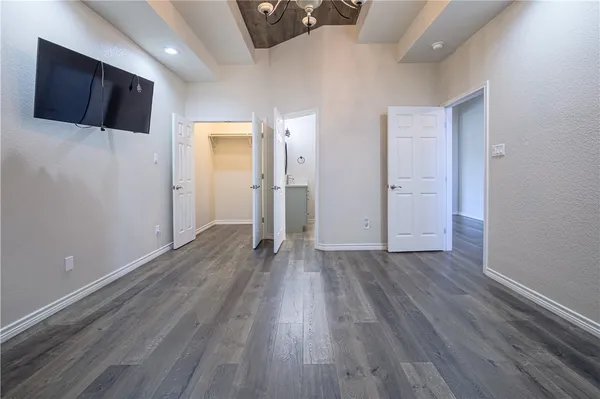 a view of a livingroom with wooden floor