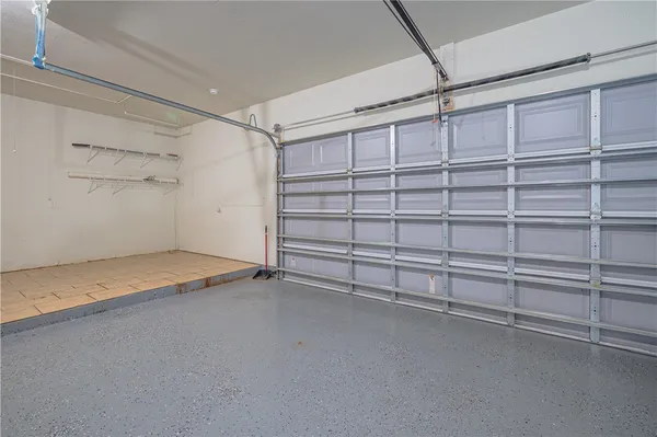 a view of a room with shelf and racks on the wall