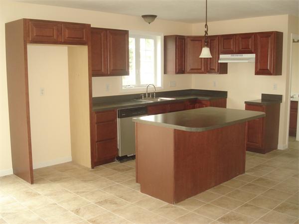 13 Canton Street Springfield, MA 01104 - Photo 3 of 23 a kitchen with stainless steel appliances granite countertop a sink and a refrigerator