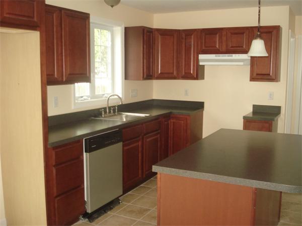 13 Canton Street Springfield, MA 01104 - Photo 4 of 23 a kitchen with a sink a cabinets and window