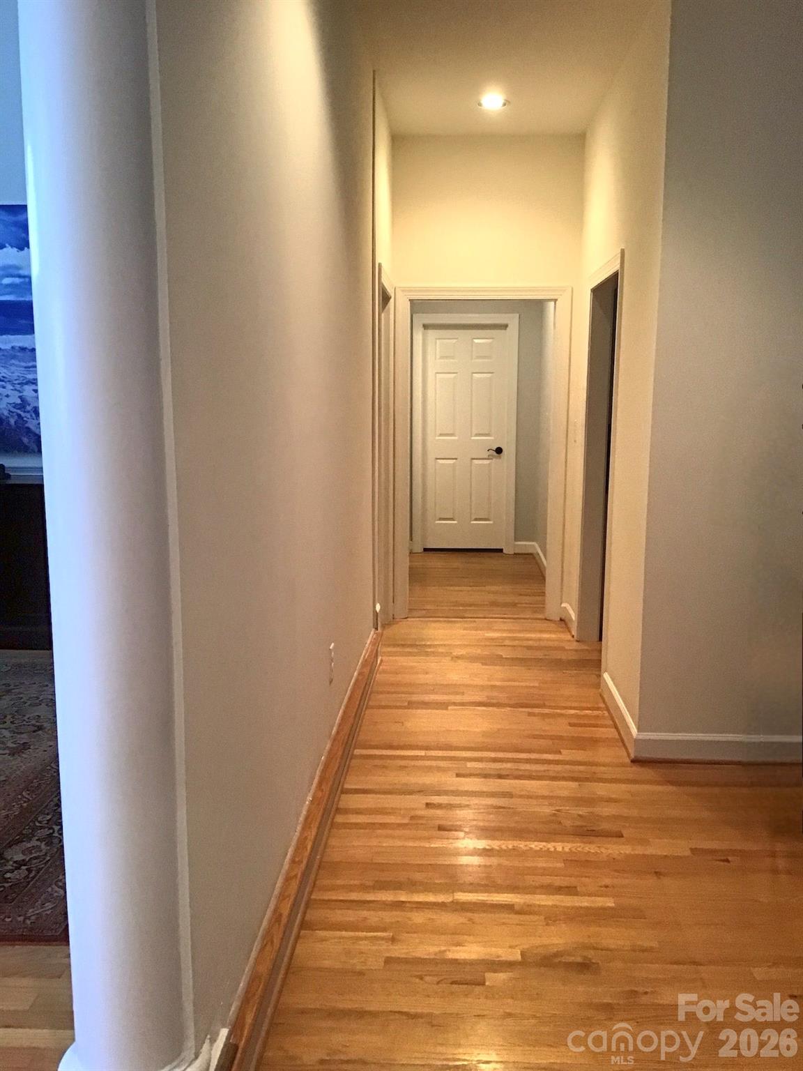 1337 Braeburn Road Northwest Concord, NC 28027 - Photo 5 of 36 a view of a hallway with wooden floor and closet