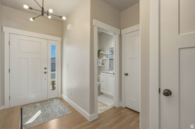 836 South 250 West Vernal, UT 84078 - Photo 7 of 56 Foyer entrance with light wood-type flooring and suspended lighting