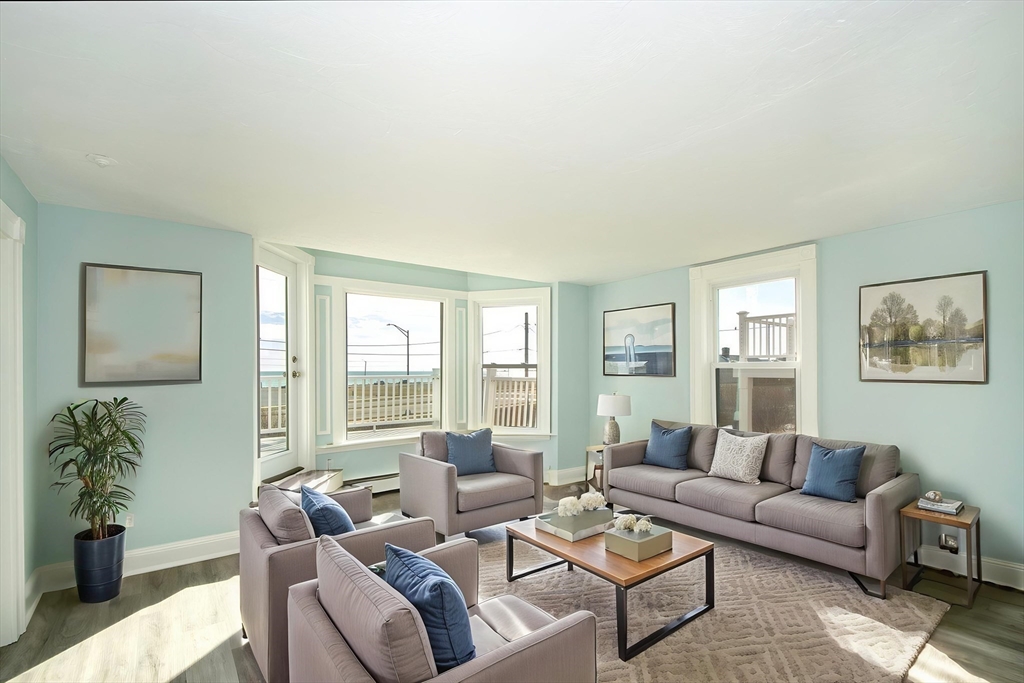 7 Whitehead Avenue, Unit 1 Hull, MA 02045 - Photo 14 of 32 a living room with furniture and a large window