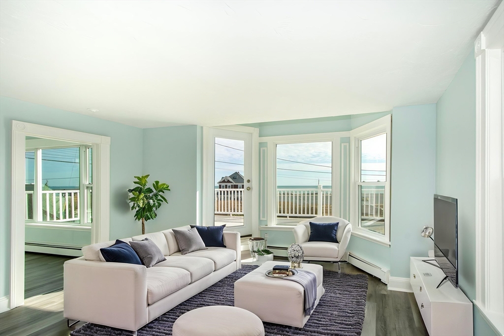 7 Whitehead Avenue, Unit 1 Hull, MA 02045 - Photo 17 of 32 a living room with furniture and a large window