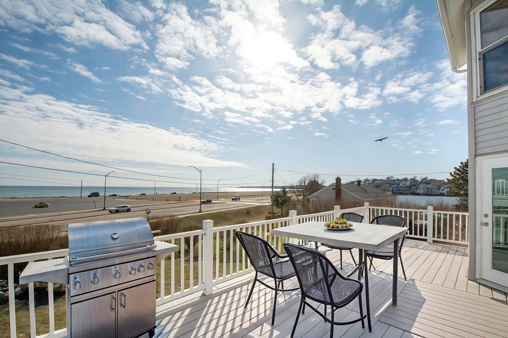 7 Whitehead Avenue, Unit 1 Hull, MA 02045 - Photo 19 of 32 a view of a terrace with furniture and stove