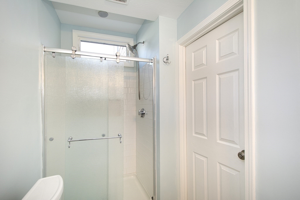 7 Whitehead Avenue, Unit 1 Hull, MA 02045 - Photo 29 of 32 a bathroom with a shower