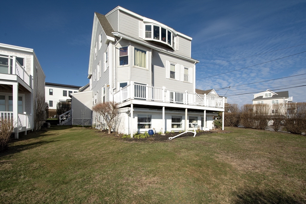 7 Whitehead Avenue, Unit 1 Hull, MA 02045 - Photo 32 of 32 a front view of a building with a yard
