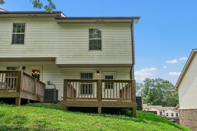 a green field with lots of trees in it
