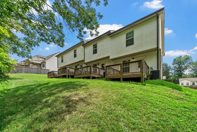 a view of backyard with deck