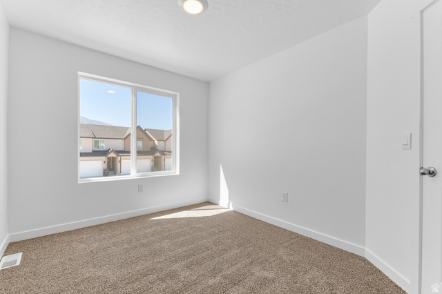 1851 East Corriente Drive, Unit 1166 Salem, UT 84653 - Photo 8 of 16 Carpeted spare room featuring baseboards