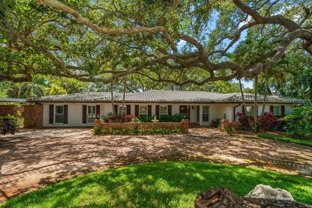 a house view with a sitting space and garden