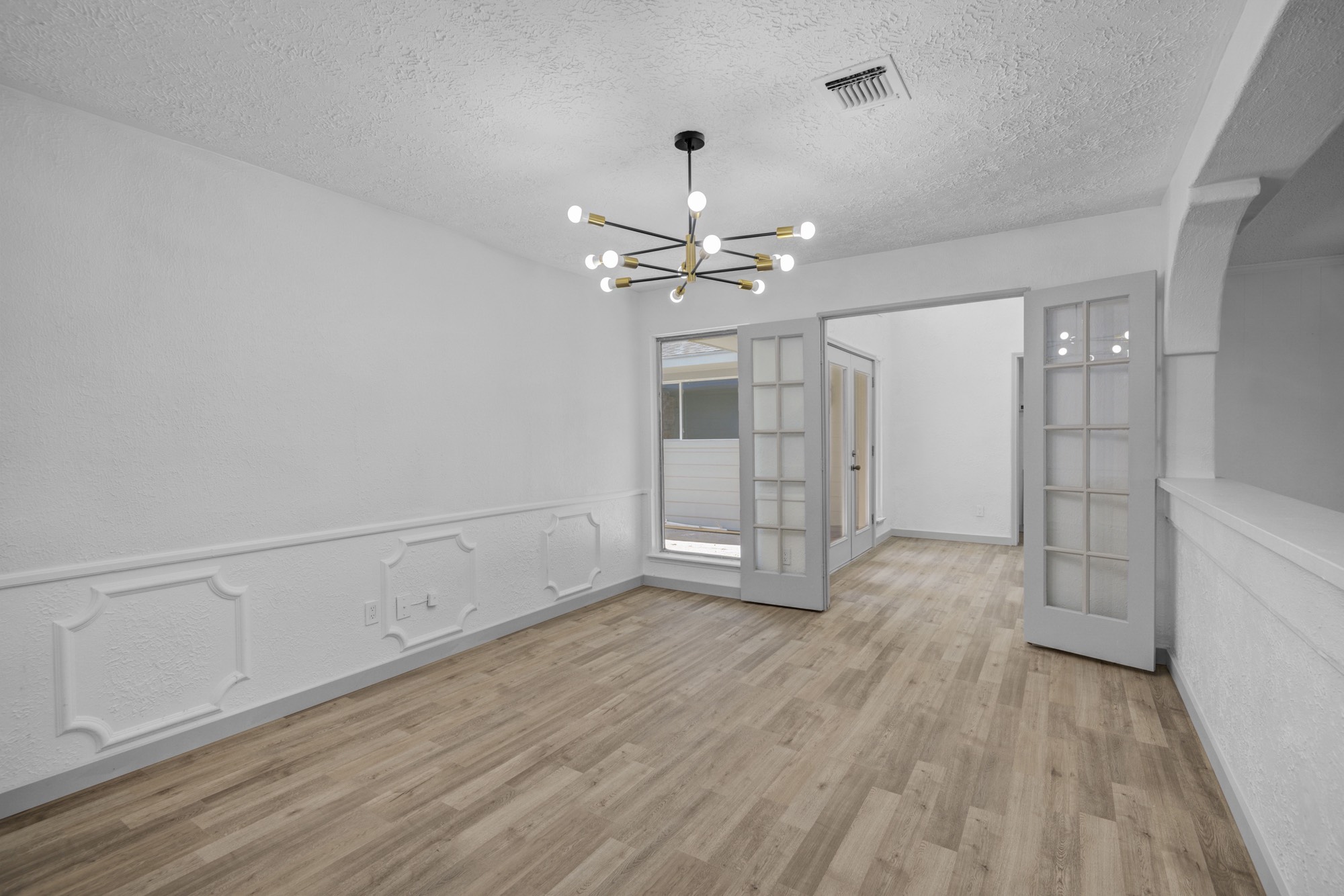 13747 Rampchester Lane Houston, TX 77015 - Photo 6 of 24 wooden floor in an empty room with a window