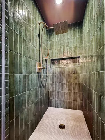 a bathroom with a shower and a sink
