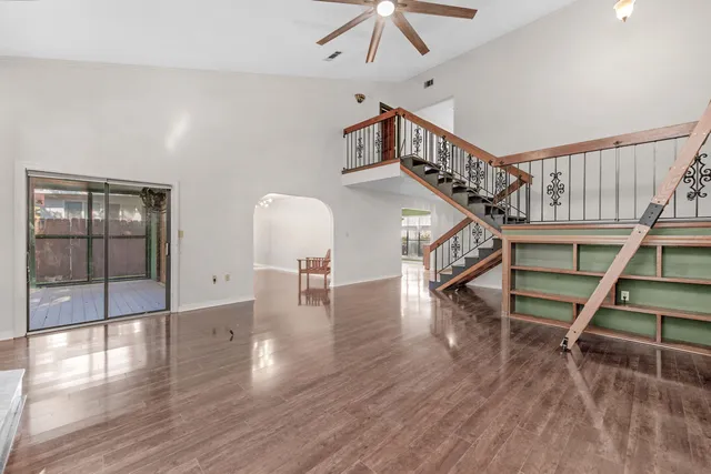 a view of entryway and hall with wooden floor