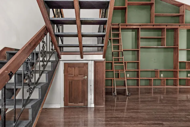 a view of a hardwood & staircase