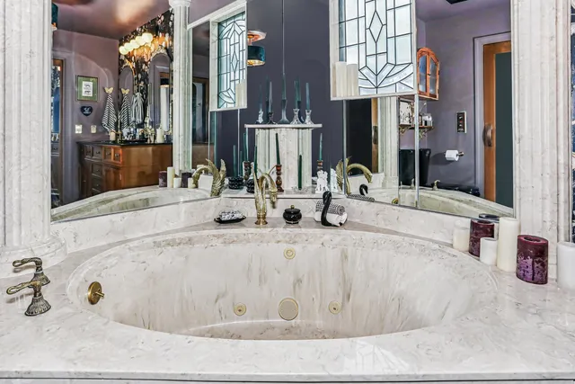 a bathroom with sinks and a mirror