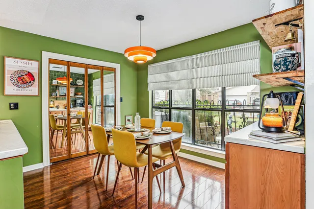 a view of a dining room with furniture window and outside view