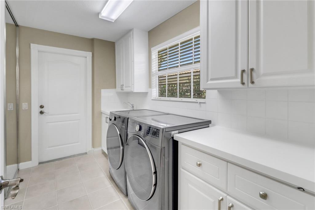 5365 Guadeloupe Way Naples, FL 34119 - Photo 12 of 47 a utility room with dryer and washer
