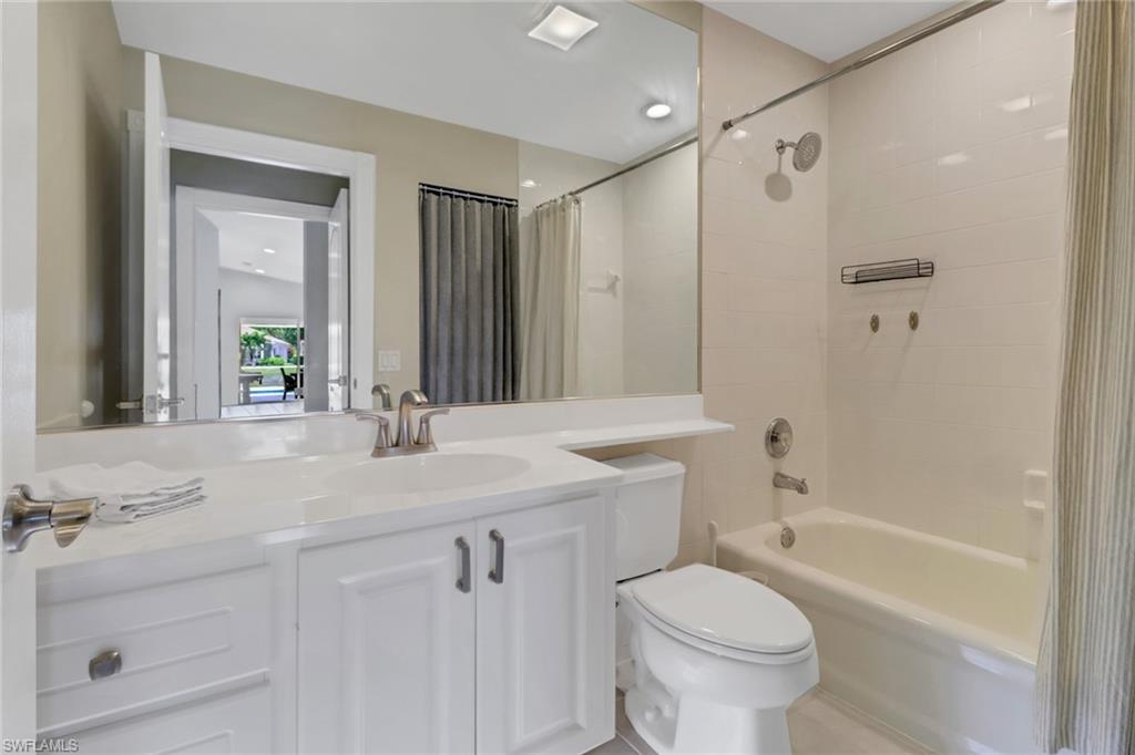 5365 Guadeloupe Way Naples, FL 34119 - Photo 13 of 47 a bathroom with a sink toilet and shower