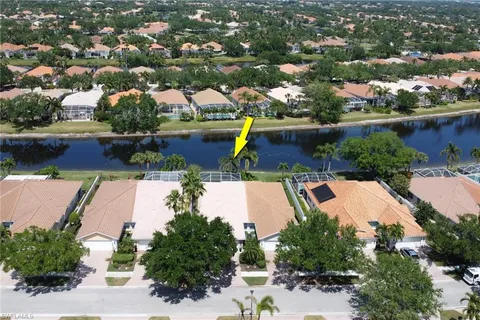 an aerial view of house with yard swimming pool and outdoor seating
