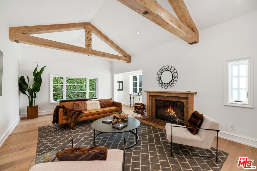 514 Walden Drive Beverly Hills, CA 90210 - Photo 13 of 59 a living room with furniture and a fireplace