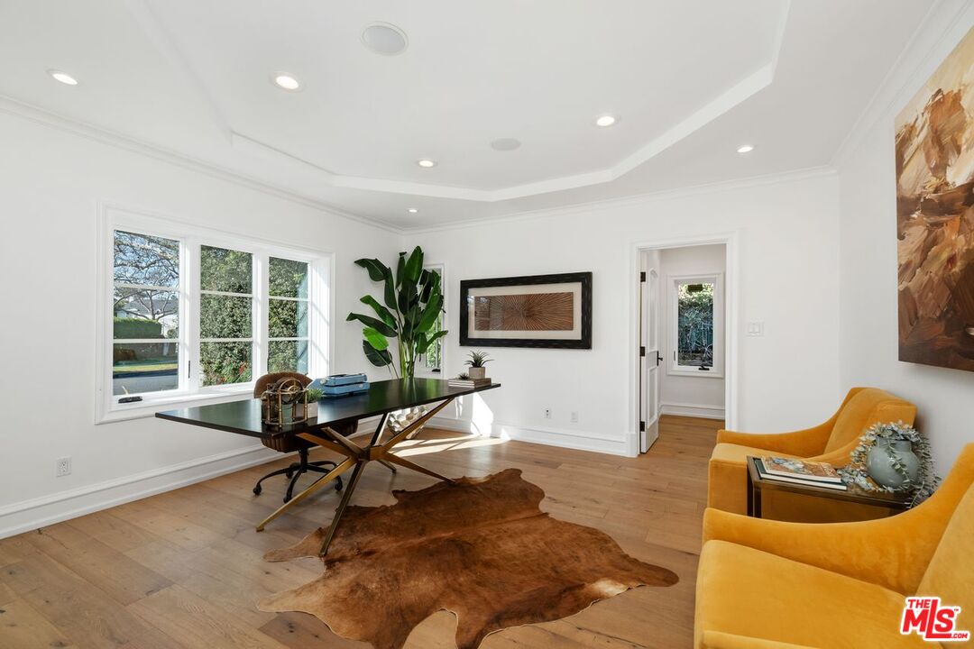 514 Walden Drive Beverly Hills, CA 90210 - Photo 16 of 59 a living room with furniture and a large window