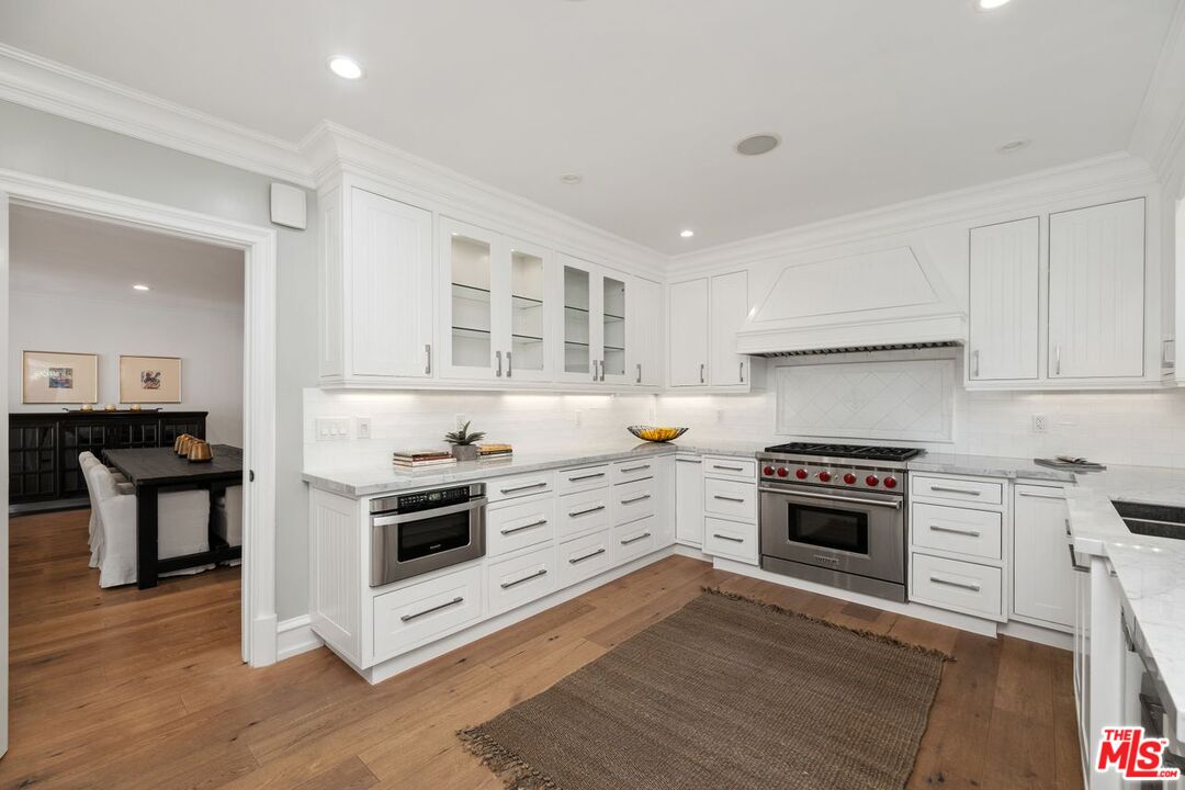 514 Walden Drive Beverly Hills, CA 90210 - Photo 24 of 59 a kitchen with a stove oven and sink