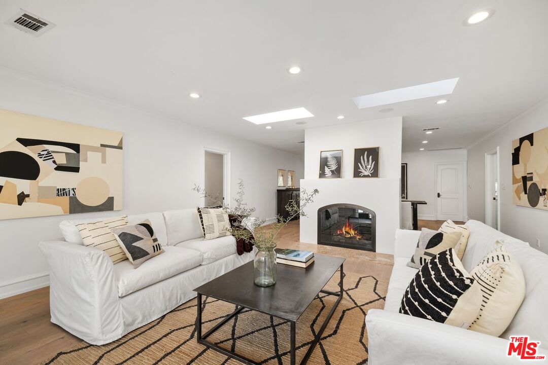 514 Walden Drive Beverly Hills, CA 90210 - Photo 29 of 59 a living room with furniture and a fireplace