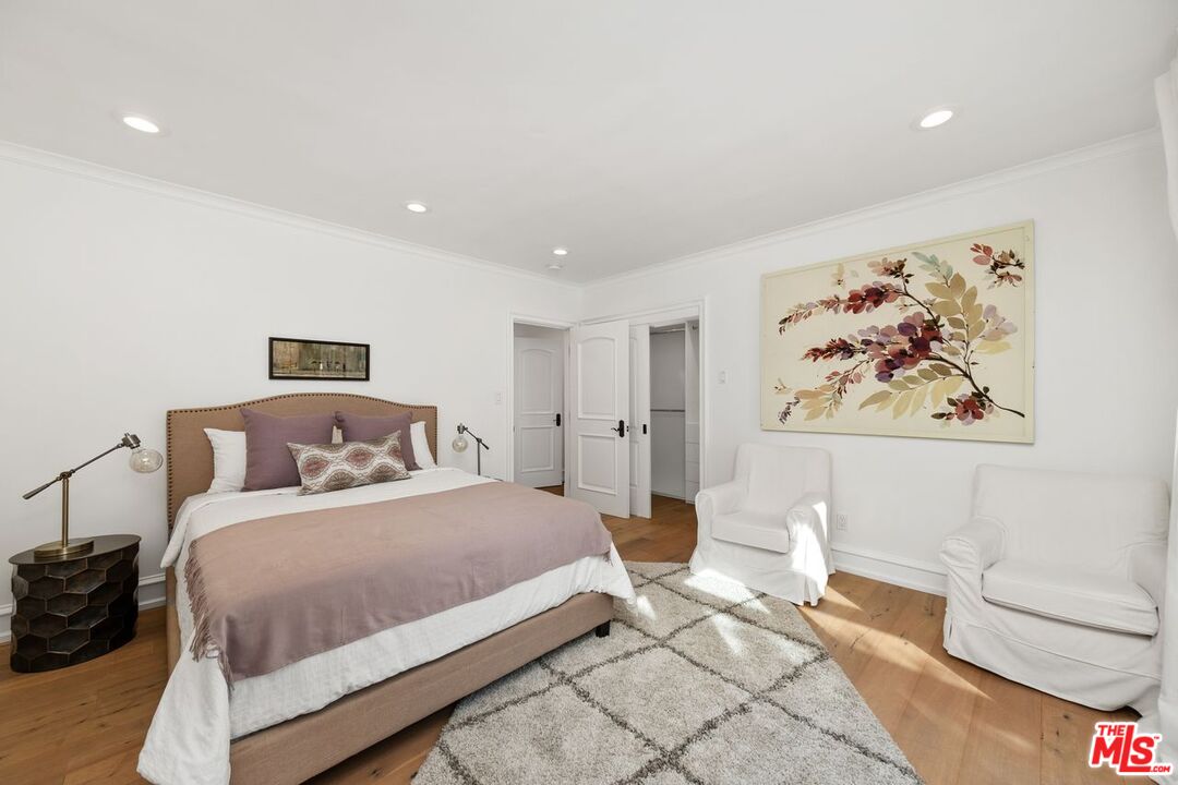 514 Walden Drive Beverly Hills, CA 90210 - Photo 35 of 59 a bedroom with a bed and a couch