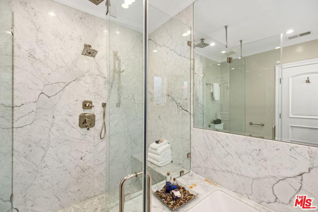 514 Walden Drive Beverly Hills, CA 90210 - Photo 42 of 59 a bathroom with a shower and a sink