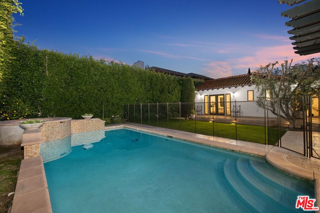 514 Walden Drive Beverly Hills, CA 90210 - Photo 58 of 59 a view of a house with a yard