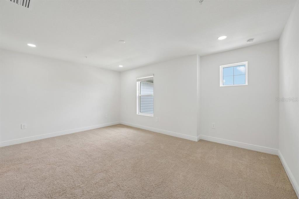17712 Broadleaf Loop Venice, FL 34293 - Photo 7 of 23 a view of an empty room with a window