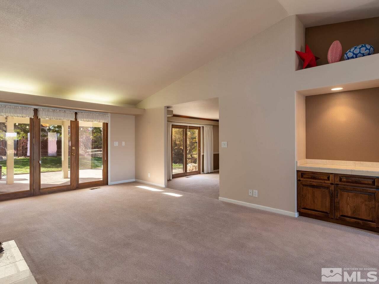 7210 Cheltenham Way Reno, NV 89502 - Photo 12 of 26 a view of an empty room with window and cabinet