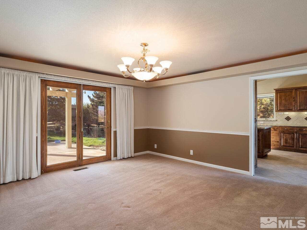 7210 Cheltenham Way Reno, NV 89502 - Photo 13 of 26 a view of an empty room with a window