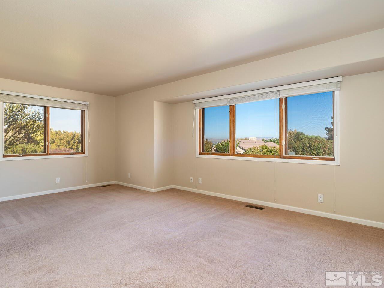 7210 Cheltenham Way Reno, NV 89502 - Photo 15 of 26 an empty room with windows