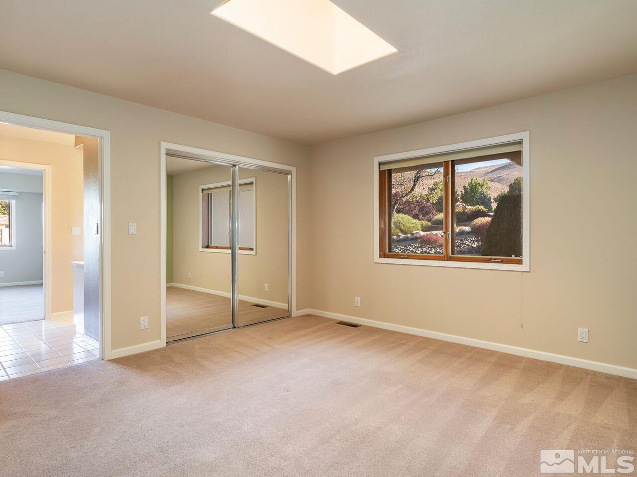 7210 Cheltenham Way Reno, NV 89502 - Photo 16 of 26 an empty room with windows and closet