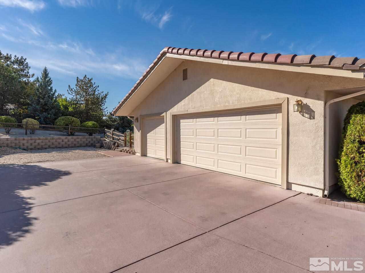 7210 Cheltenham Way Reno, NV 89502 - Photo 26 of 26 a view of a house with a garage
