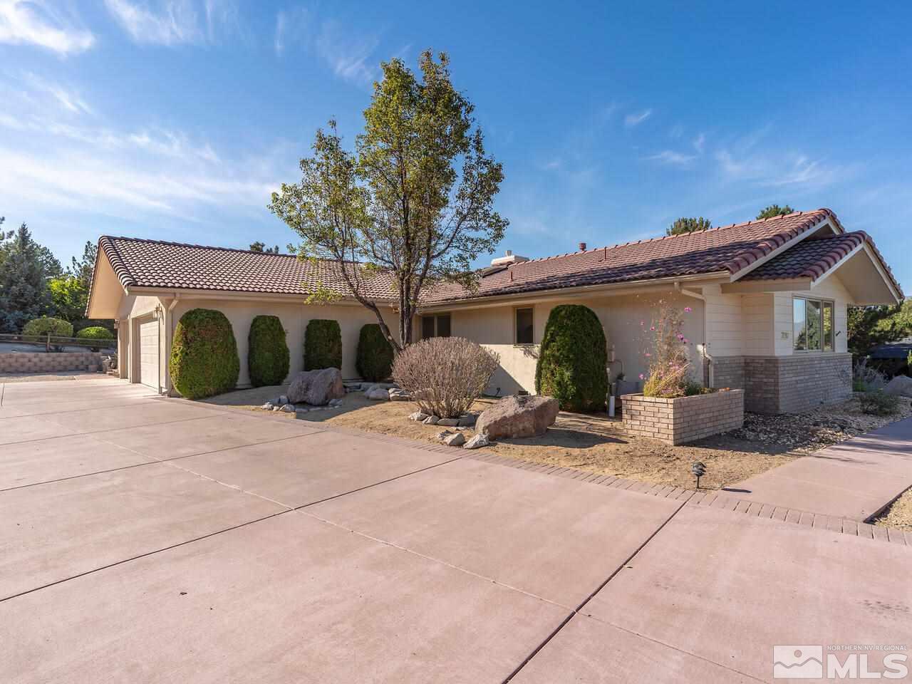 7210 Cheltenham Way Reno, NV 89502 - Photo 3 of 26 a blue and white house with outdoor space