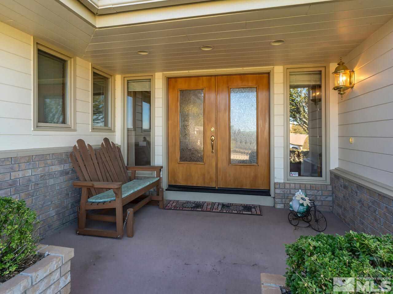 7210 Cheltenham Way Reno, NV 89502 - Photo 4 of 26 a backyard of a house with seating space