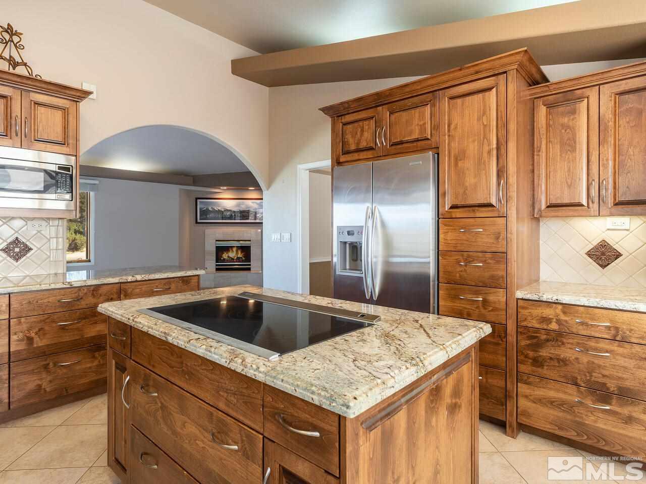 7210 Cheltenham Way Reno, NV 89502 - Photo 7 of 26 a kitchen with a sink and cabinets
