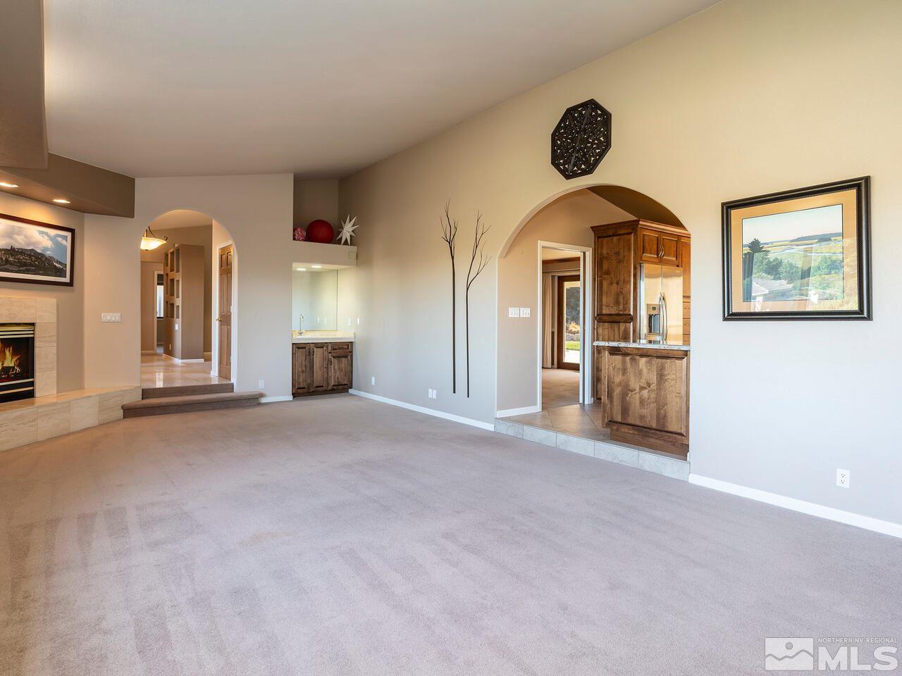 7210 Cheltenham Way Reno, NV 89502 - Photo 9 of 26 a view of a room with furniture and a fireplace