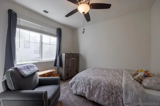 a large bathroom with a granite countertop sink mirror and bathtub